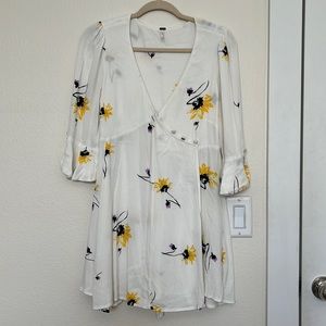 Beautiful free people white wrap dress with floral design. Size S/P.